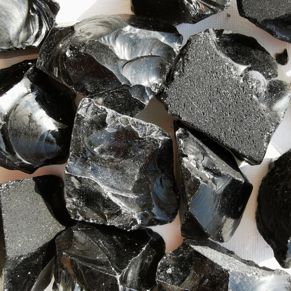  Black Obsidian Rough Crystal - An image featuring a raw and unpolished black obsidian crystal. It showcases the natural formations and textures of black obsidian.