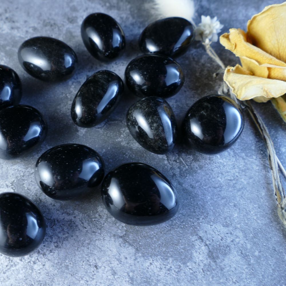 Dumi's Crystals Black Obsidian Tumbles - Deep black, polished obsidian stones for protection and personal growth. Each stone measures 2-2.5cm, ideal for carrying or adding to your crystal grid.  