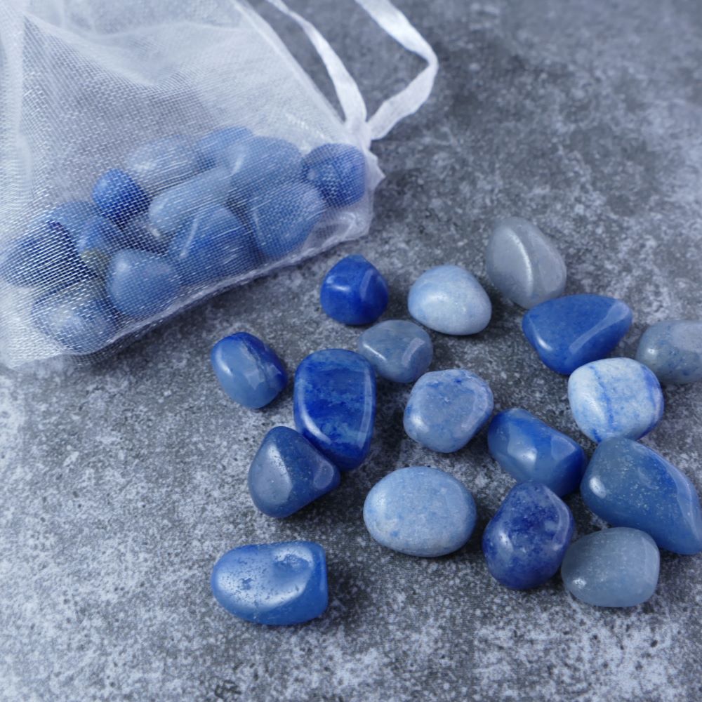 Dumi's Crystals | Blue Aventurine Chips (1-1.5cm) | Close-up of a collection of genuine Blue Aventurine chips, highlighting their calming blue color and variations in size and texture. Blue Aventurine is revered for its ability to promote inner peace, emotional balance, and spiritual growth.