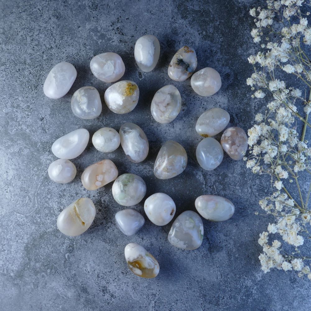 Dumi's Crystals Flower Agate Tumbles - Delicately beautiful! Soft pinks, creams, and greys resembling flowers. These 1.5-2cm stones promote gentle growth and make a lovely addition to your collection.