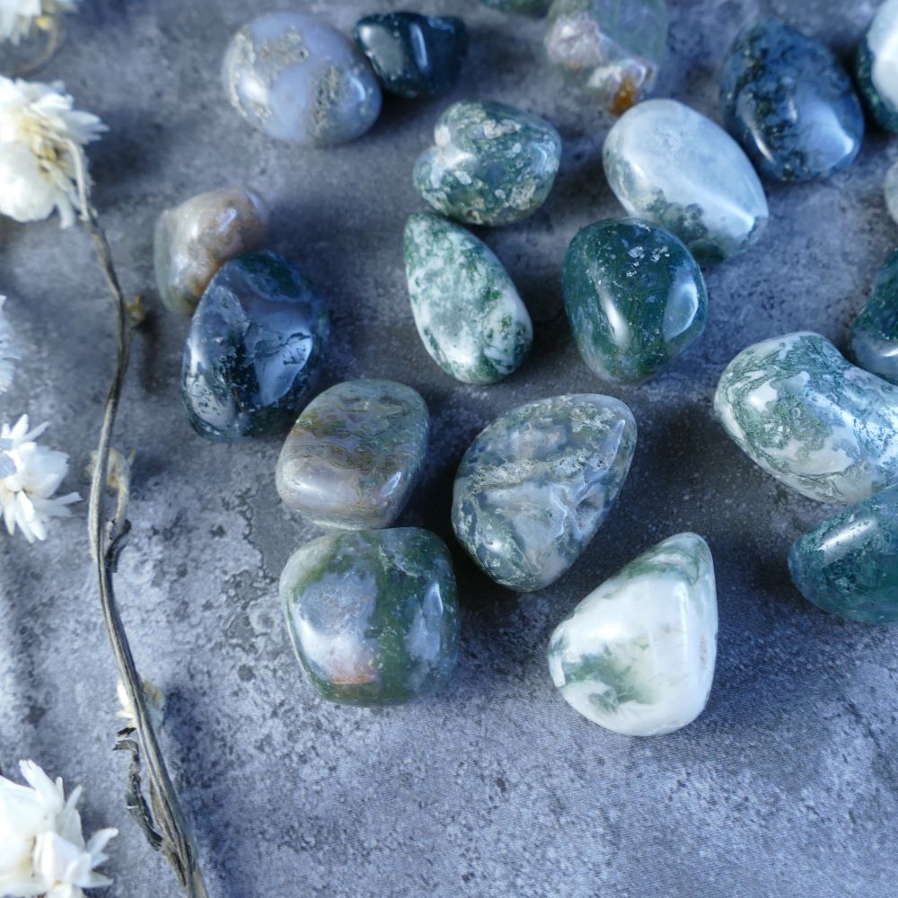 Moss Agate Crystal Tumbles - Enhance your well-being with Dumi's Crystals! Polished to a smooth finish, these enchanting stones (1.5-2cm) showcase green and white moss-like patterns. Perfect for fostering emotional balance and growth.  