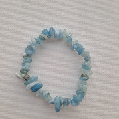 Dumi's Crystals Aquamarine Chip Bracelet: Embrace tranquility with shimmering Aquamarine chips. Promotes emotional balance, clear thinking & self-expression.