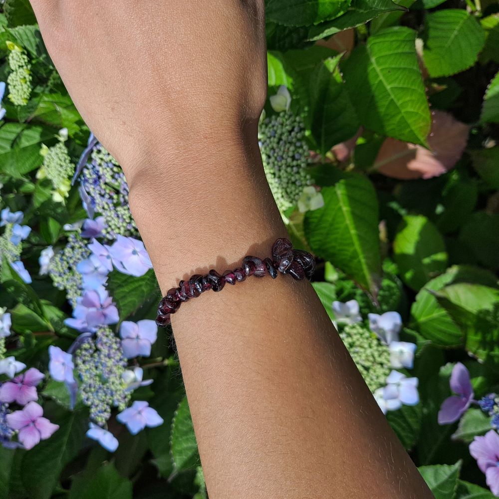 Dumi's Crystals | Garnet Stretch Bracelet (7 Inch) | Showcasing the fiery energy of Garnet on a wrist. This bracelet features genuine Garnet beads in a captivating red color. Garnet, January's birthstone, promotes passion, strength, and vitality.