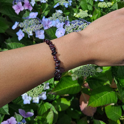 Dumi's Crystals | Garnet Stretch Bracelet (7 Inch) | Showcasing the fiery energy of Garnet on a wrist. This bracelet features genuine Garnet beads in a captivating red color. Garnet, January's birthstone, promotes passion, strength, and vitality.