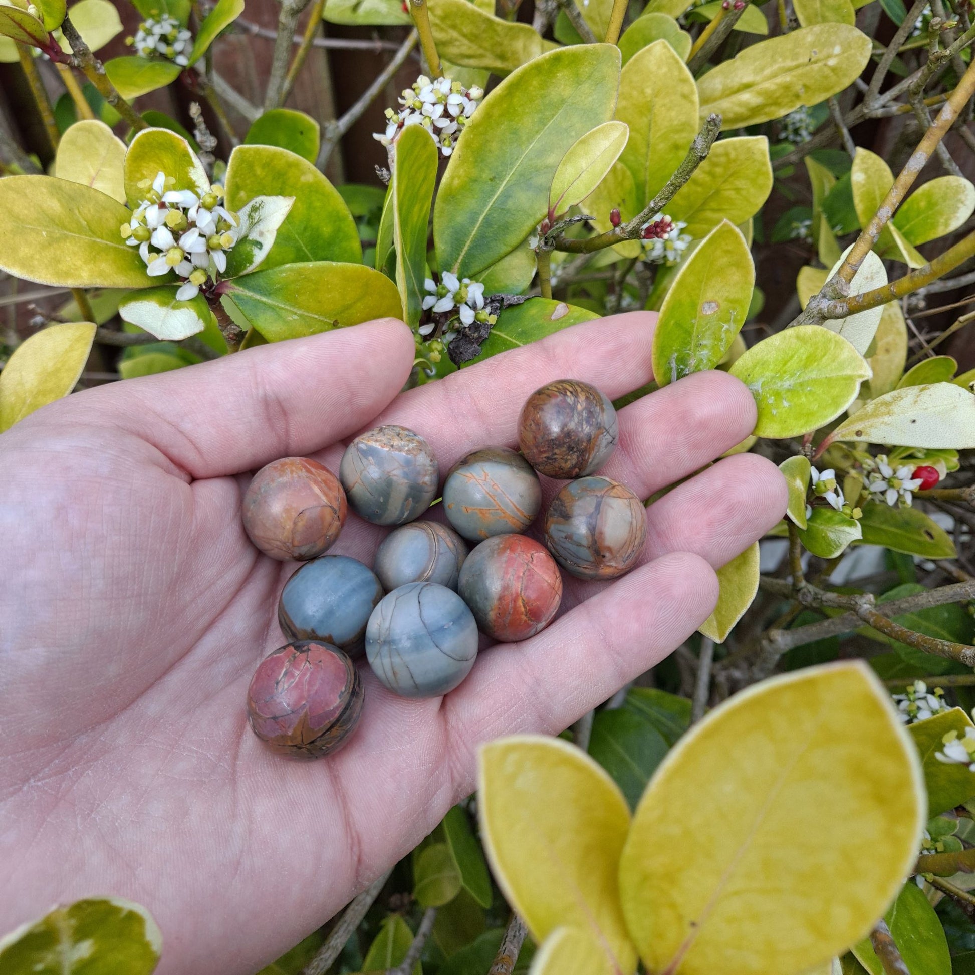 Dumi's Crystals | Frosted Polychrome Jasper Mini Spheres (20mm) | A collection of captivating Frosted Polychrome Jasper Mini Spheres, each displaying a unique variation of earthy tones with a beautiful frosted finish. These 20mm spheres are believed to promote peace, balance, and inner strength. Perfect for meditation, crystal grids, or carrying with you throughout the day.