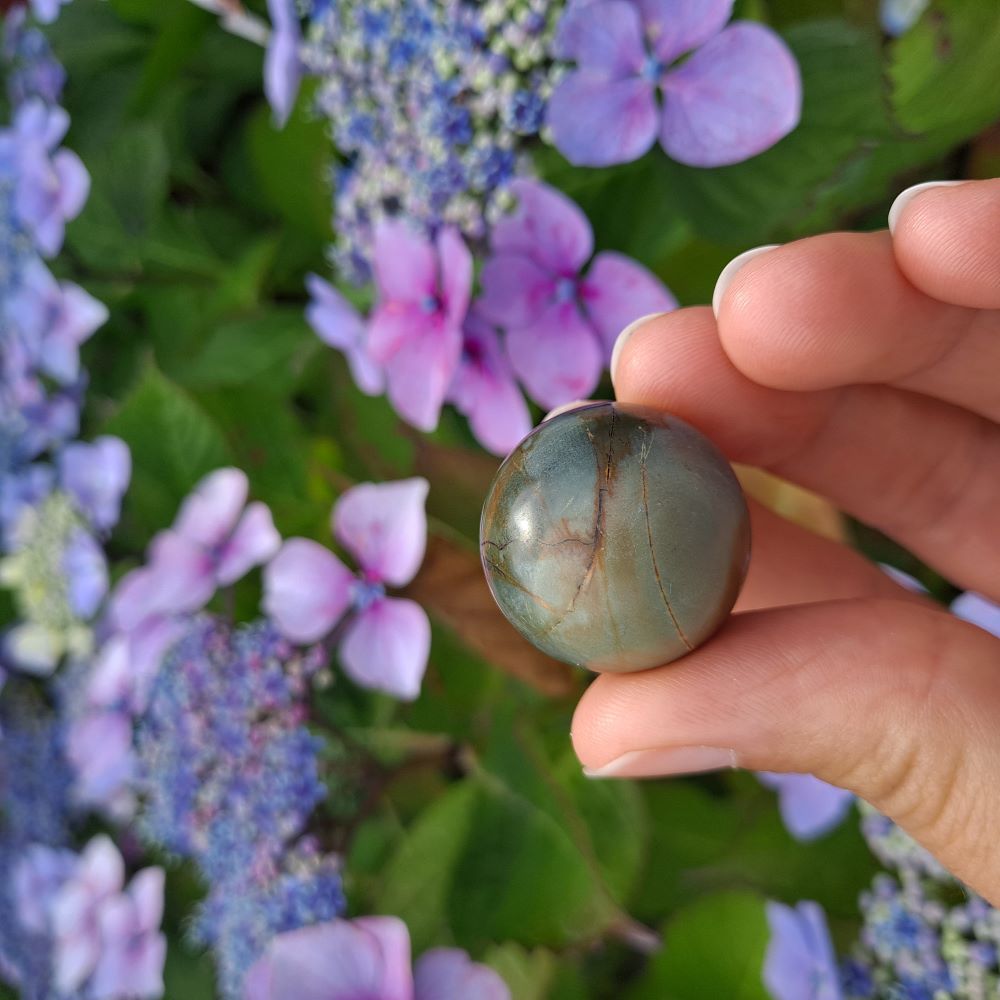 Frosted Polychrome Jasper mini sphere for peace & balance (25mm) | Dumi's Crystals | Embrace the tranquillity of Frosted Polychrome Jasper! This mini sphere (25mm) is known for fostering harmony, reducing stress, and promoting a sense of security.