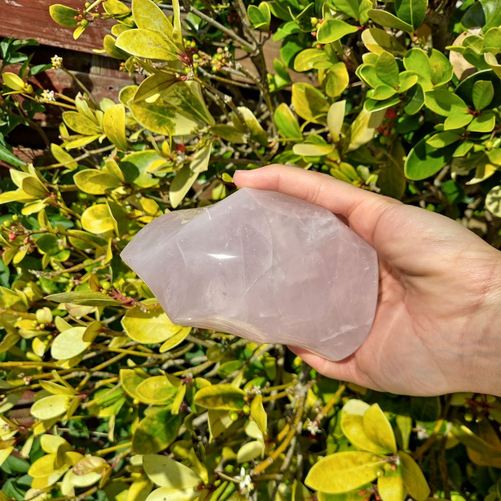 Hand-carved Rose Quartz Flame: Embrace the gentle energy of rose quartz with this beautiful flame-shaped crystal. 